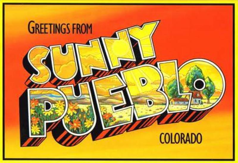 A vintage-style postcard with "Greetings from Sunny Pueblo Colorado" in bold yellow and black letters, featuring a bright orange background, sun, flowers, and a house with trees.